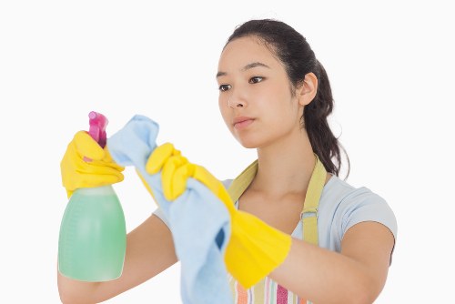 Carpet cleaning team preparing equipment with safety focus