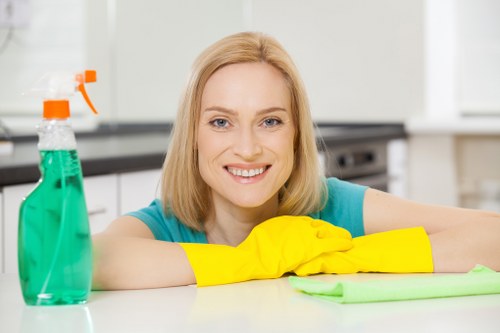 Staff member wearing PPE while carrying out carpet cleaning